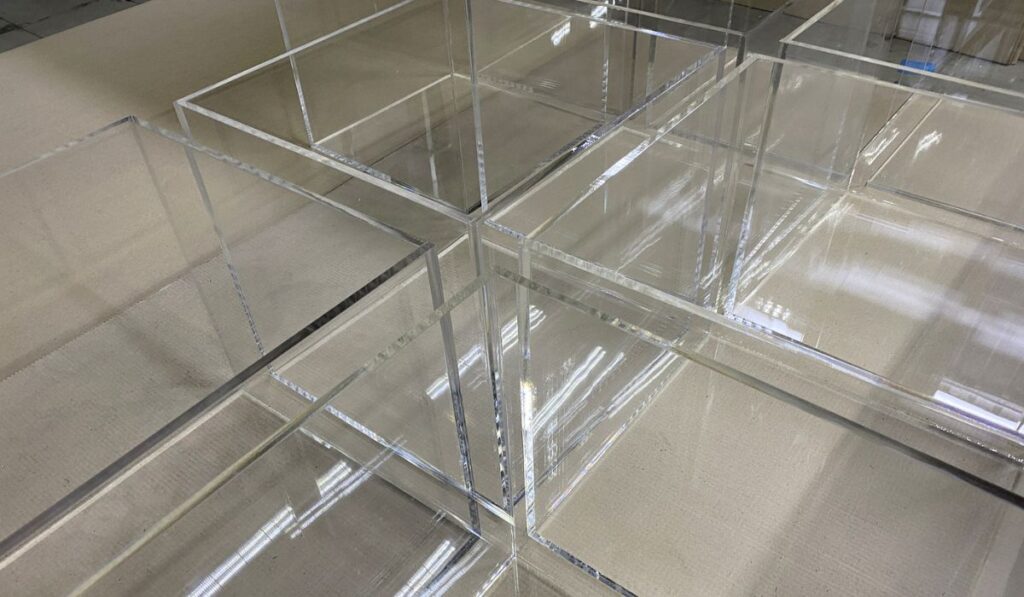 Transparent plexiglass cubes in production