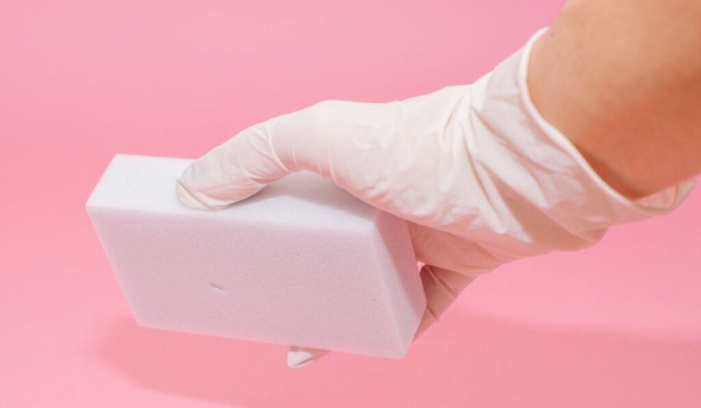 Melamine sponges on pink background