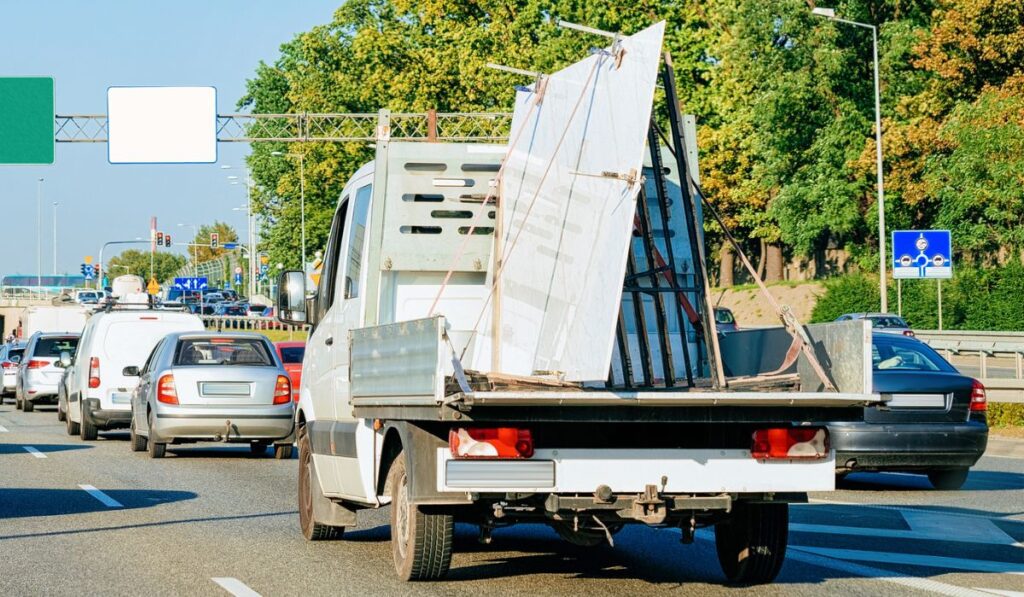 Car carrying trailer in asphalt road of Slovenia