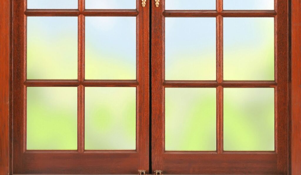 Wooden frame for a window with frosted glass
