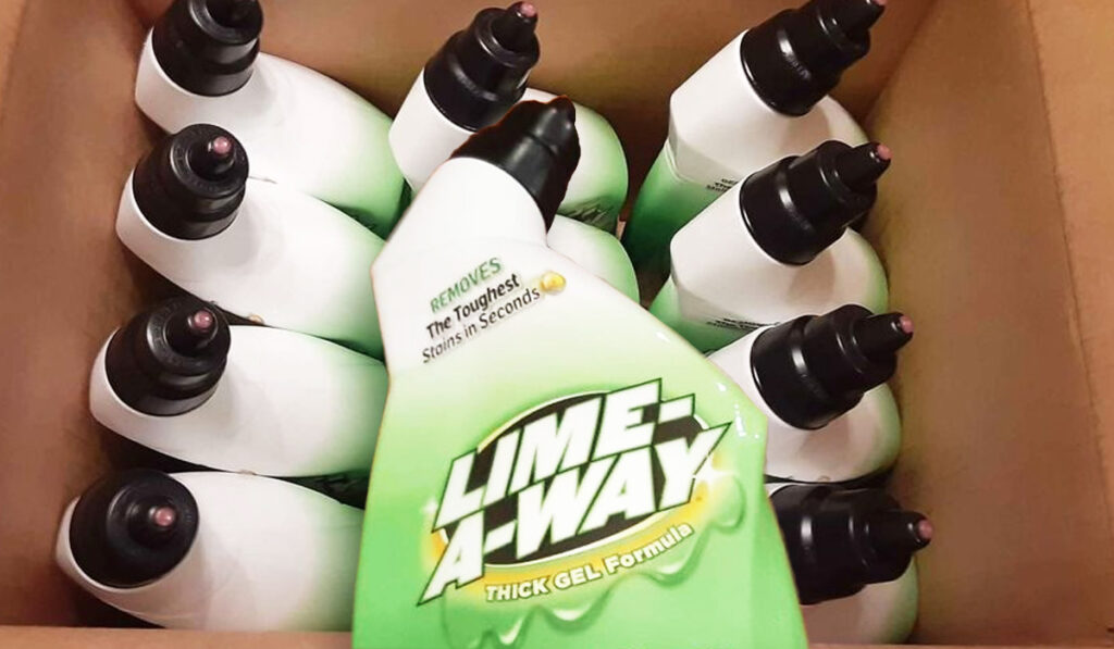 Lime A Way bottle over box of other Lime A Way products