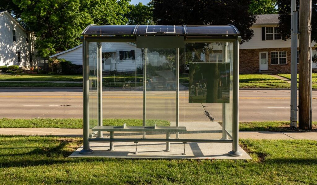 Clear plexiglass waiting spot for civic transportation